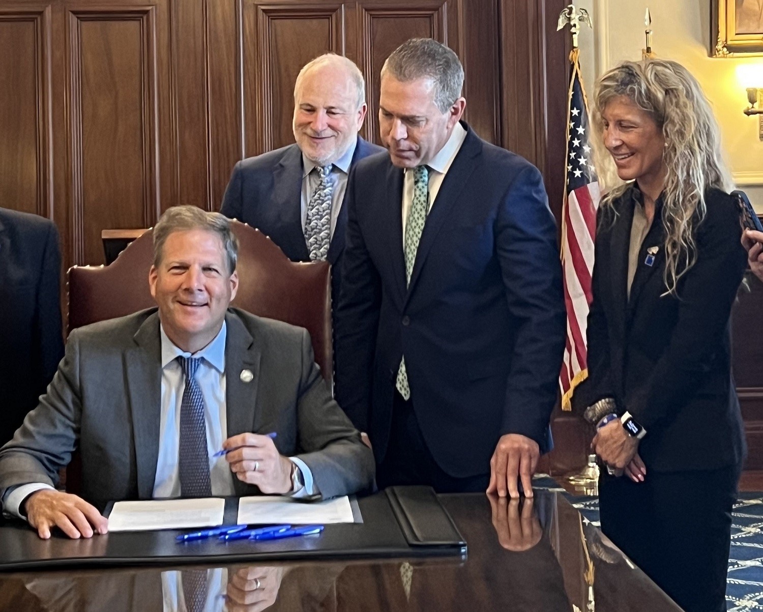 thumbnail_StandWithUs Mid-Atlantic Director Julie Paris and Ambassador Gilad Erdan, at the Signing with NH Gov. Chris Sununu 1.jpg