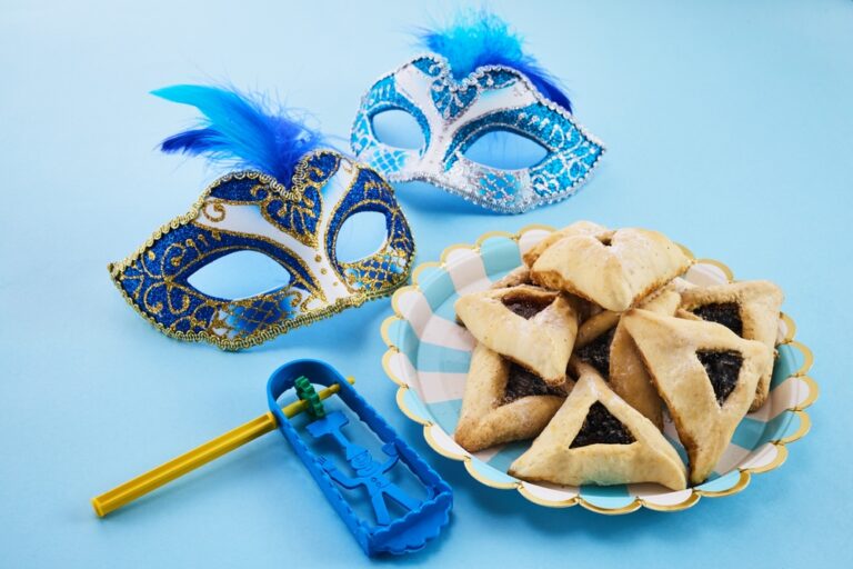 JewishHolidayPurimBackgroundWithHamantaschenOrHamansEarsCookies