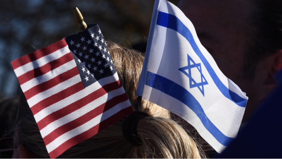 Israeli flag next to an American flag.