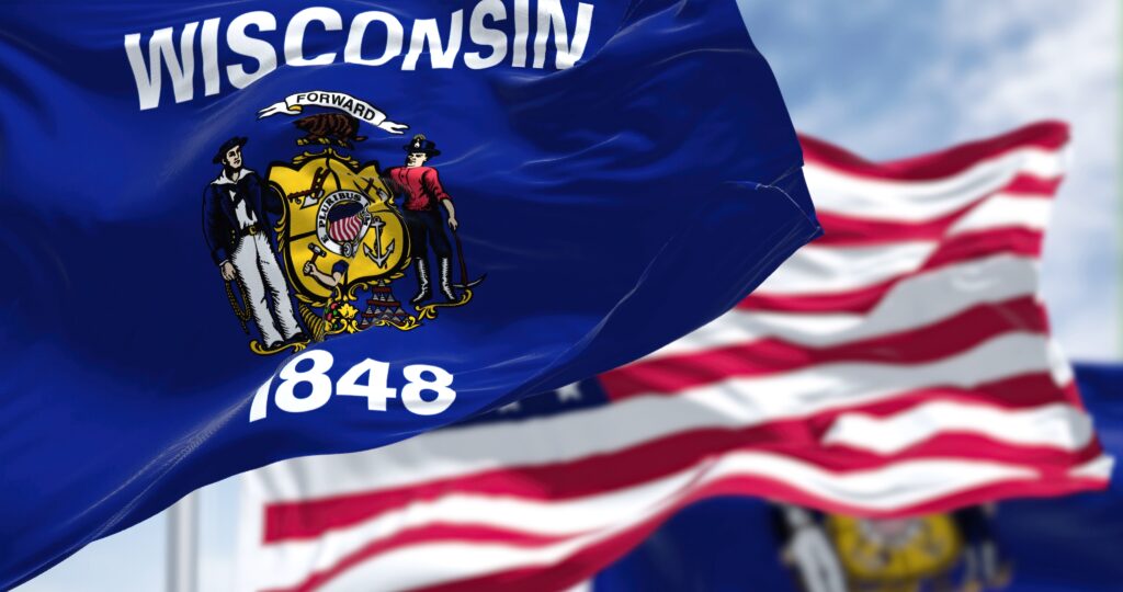 TheWisconsinStateFlagWavingAlongWithTheNationalFlag