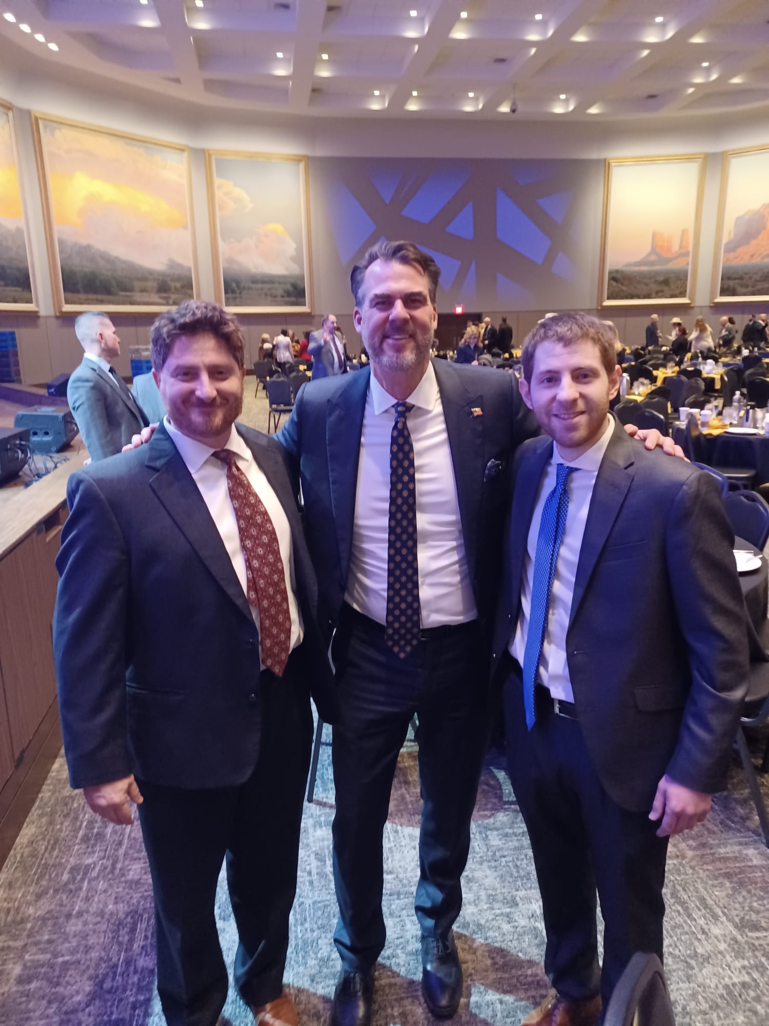 Jordan Cope (right) with Oklahoma Governor Kevin Stitt (middle)